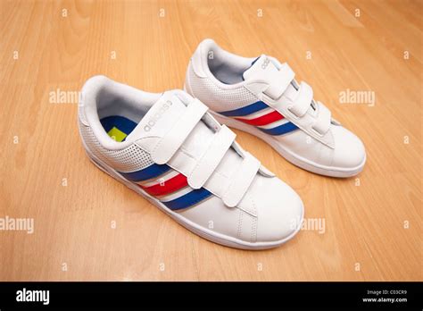 adidas trainers with velcro fastening.